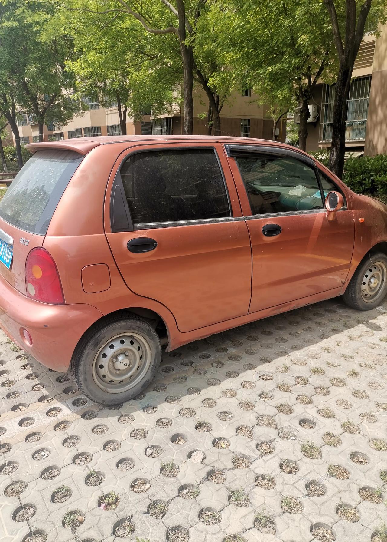 穿雨衣曾经有人问我这下雨天开奇瑞照片真实12款奇瑞qq图片qq汽车奇瑞