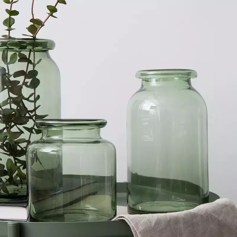 brass and clear glass test tube vases