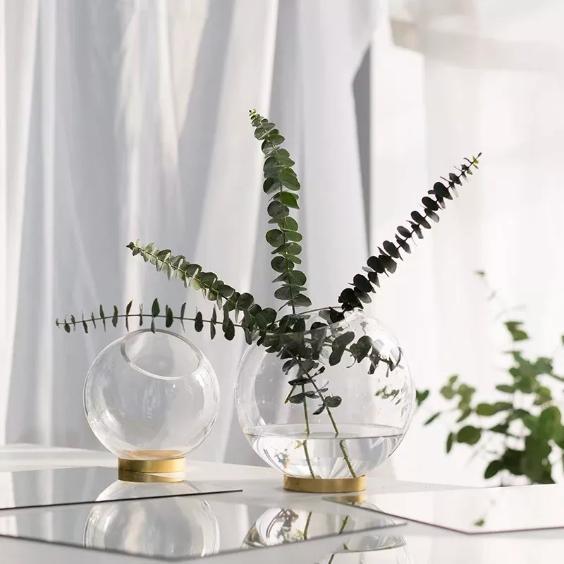 brass and clear glass test tube vases